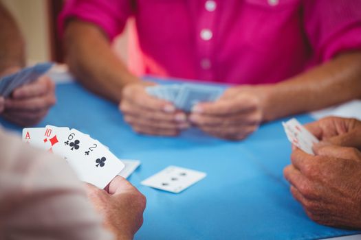Retired people playing card