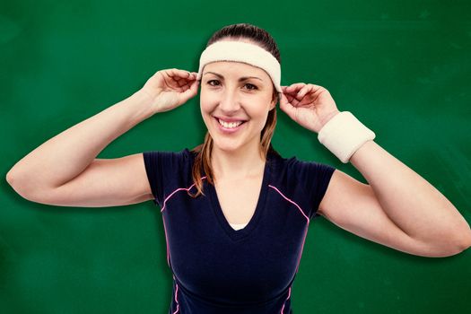 Composite image of female athlete wearing headband and wristband