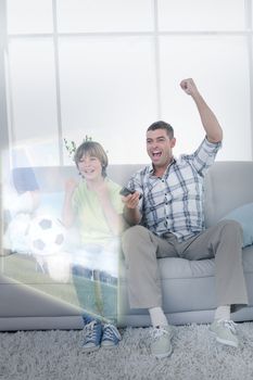 Composite image of father and son are watching sport match on television at home