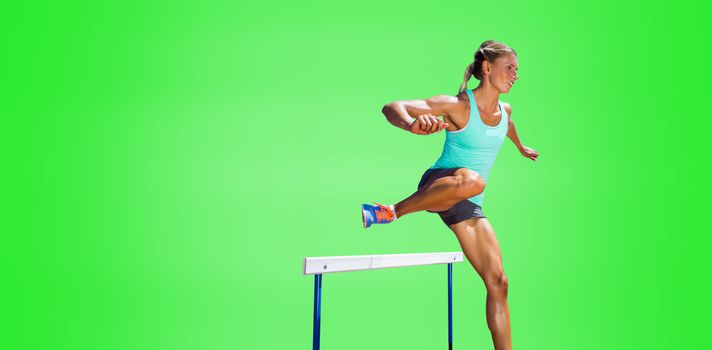 Sportswoman practising the hurdles