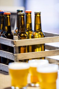 Close-up of beer bottles in crate