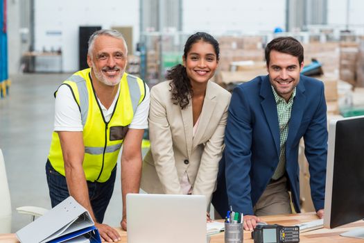 Portrait of worker team is posing and smiling during work