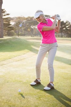 Sportswoman playing golf