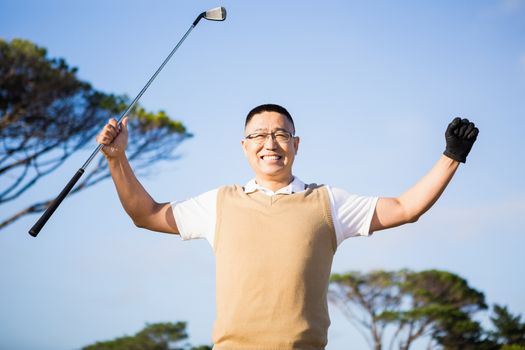 Golfer raising his hands