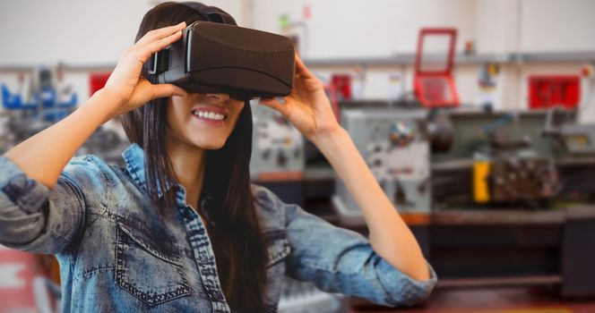 Composite image of woman using an oculus