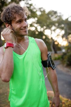 Jogger listening to music on mobile phone