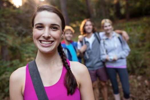 Portrait of smiling woman hiking with her friends