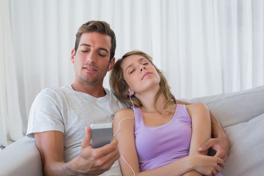 Couple listening music with mobile phone