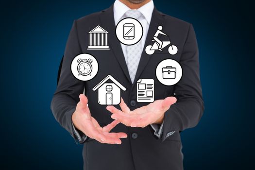 Businessman holding different icons