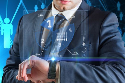 Businessman looking at smart watch with business graph