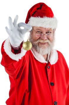 Santa claus holding christmas bauble