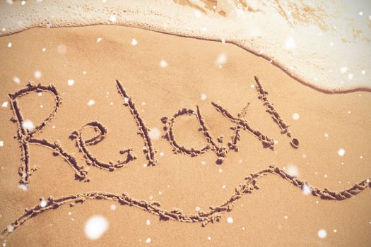 Relax written on sand