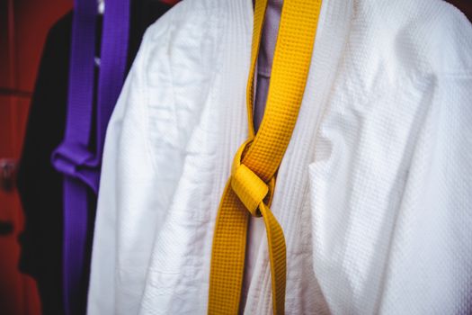 Two karate uniforms hanging on locker