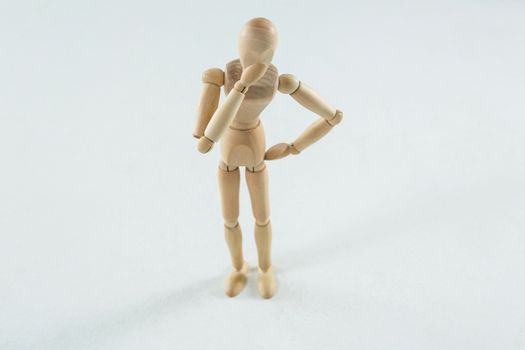 Tensed wooden figurine standing