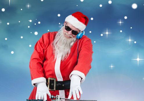 Santa in sunglasses playing dj