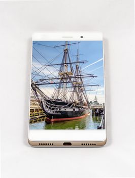 Modern smartphone displaying picture of USS Constitution frigate