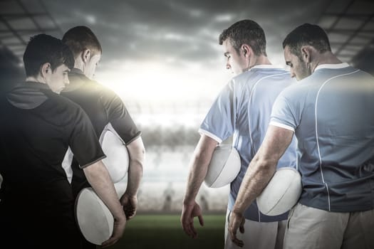Composite image of tough rugby players 