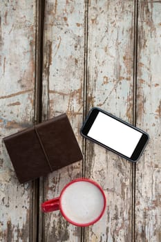 Cup of coffee with smartphone and organiser