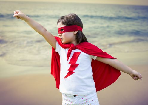 Digital composite image of girl pretending to be a superhero