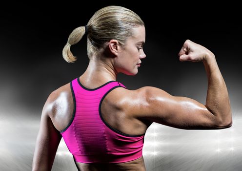 Fit woman flexing muscles