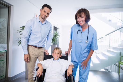 Portrait of smiling doctor and disable boy