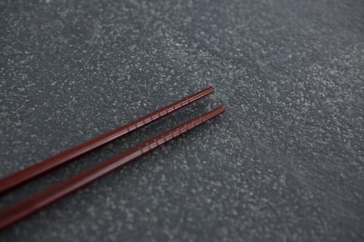 Chopsticks on a slate plate