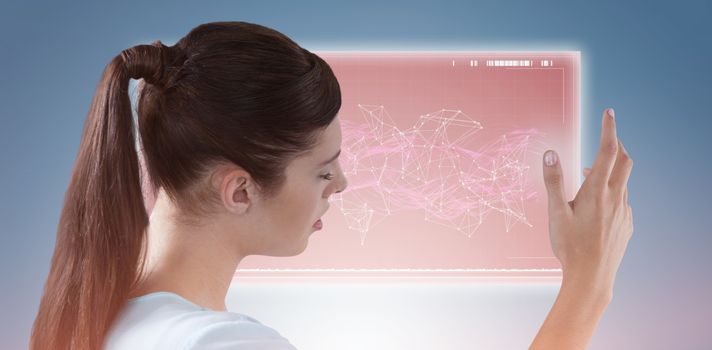 Composite image of young woman using imaginative digital screen