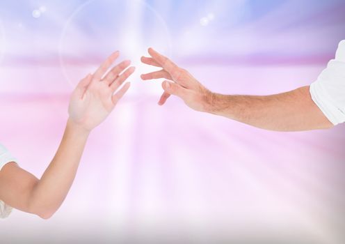 Composite Image of two Hands holding with Kindness against a light background 