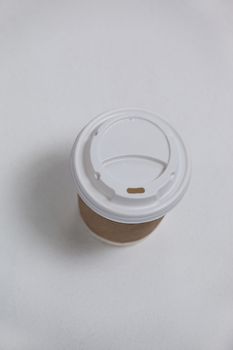 Disposable coffee cup on white background