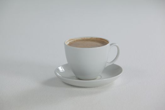White cup of coffee with froth with creamy froth