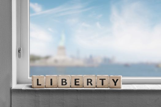 Liberty sign in a window sill with a view