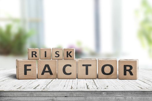 Risk factor sign on a wooden table
