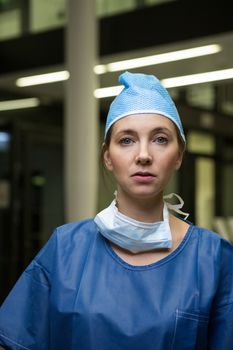 Portrait of female surgeon in protective workwear