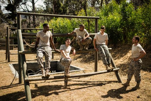 Soldiers sitting on the obstacle course