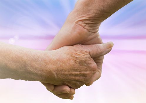 Hands holding eachother kindness against abstract background