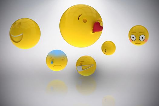 Composite image of three dimensional image of basic emoticons 3d