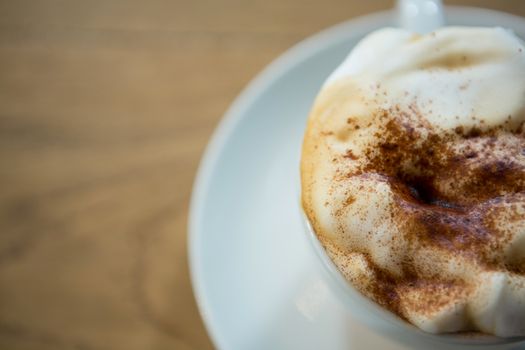 Overhead shot of coffee cup with creamy froth