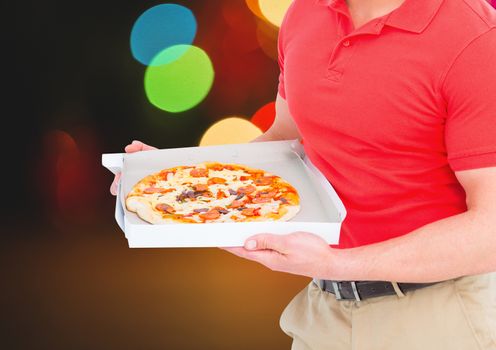 Deliveryman with pizza. Lights background