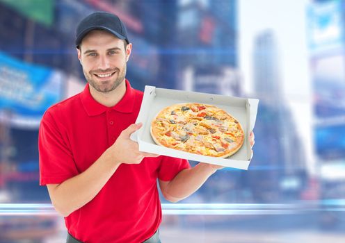 Happy deliveryman with pizza in the city with lights