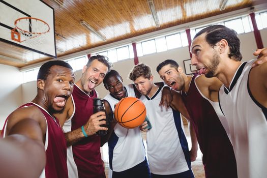 Happy basketball players making funny faces