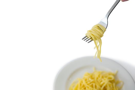 High angle view of spaghetti in plate with fork
