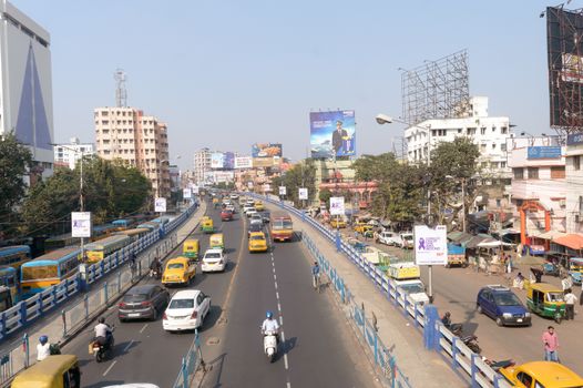 Traffic and pedestrians on crowded city streets in evening rush hour on Dhakuria bridge flyover one of the busiest area in Calcutta. Kolkata, West Bengal, India South Asia Pacific, January 2020