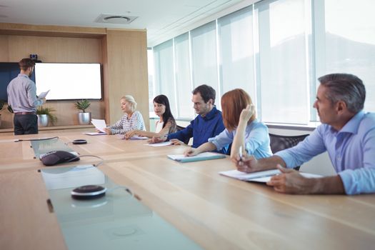Business people at conference table in board room