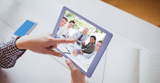 Hand touching tablet PC while video conferencing