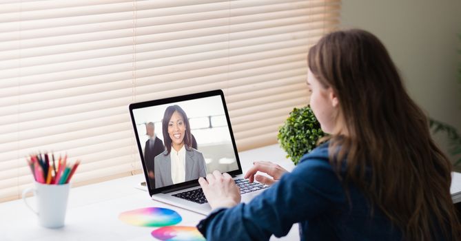 Businesswoman video conferencing in office