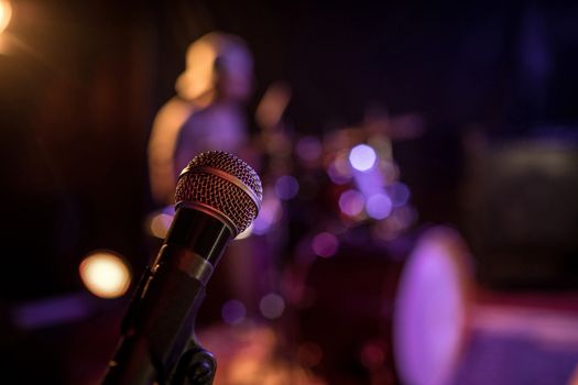 Microphone in illuminated nightclub