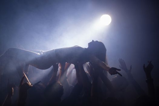 Crowd surfing at a concert