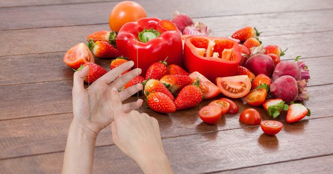 Hand taking picture of fruits and vegetables through device