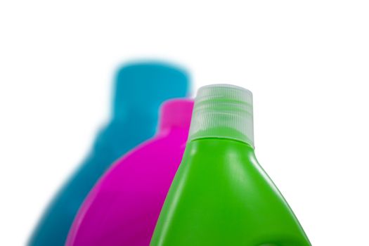 Detergent containers arranged on white background