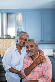 Portrait of smiling couple with arm around